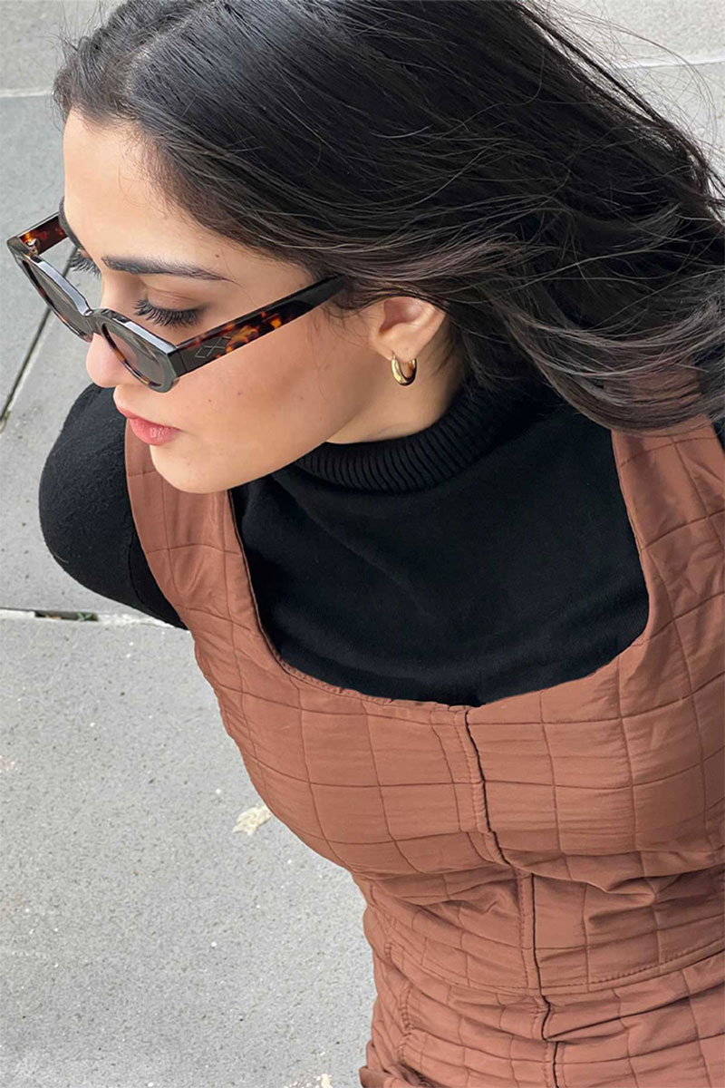 Our Hiba brown quilted dress styled with a black basic turtle neck